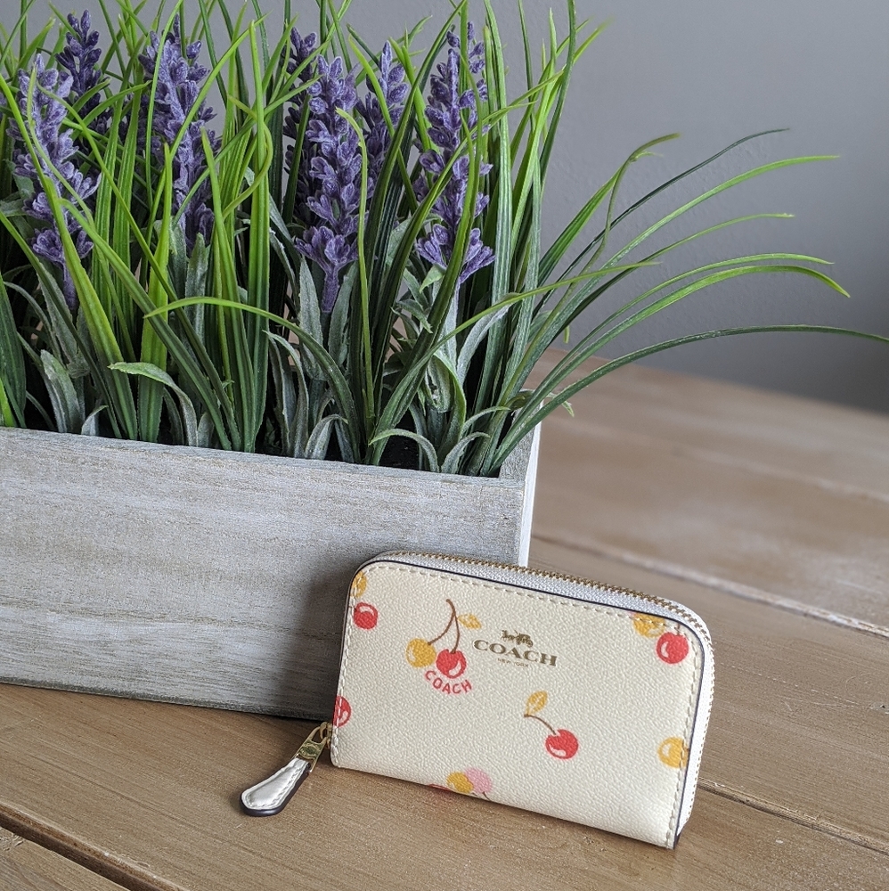 COACH zip around coin case
